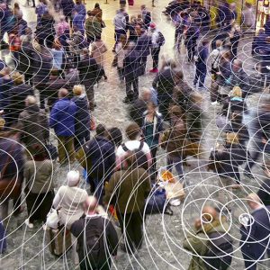 An image of a bird’s eye-view of a group of people with frequency waves around them to promote the environmental sync homeopathic patches from Frequency Apps.