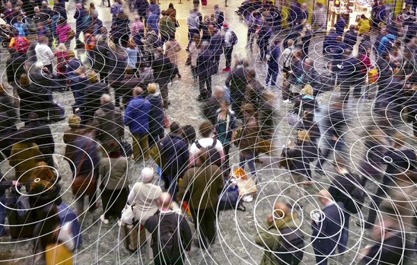 An image of a bird’s eye-view of a group of people with frequency waves around them to promote the environmental sync homeopathic patches from Frequency Apps.
