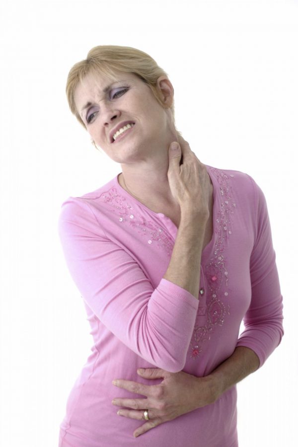 An image of a woman holding her neck and appearing in pain to promote the homeopathic patches to ease Fibromyalgia from Frequency Apps.