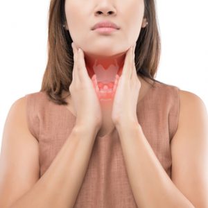 An image of a woman feeling her neck or adrenal glands to promote the medicated patches for kidney, thyroid, and adrenal support from Frequency Apps.