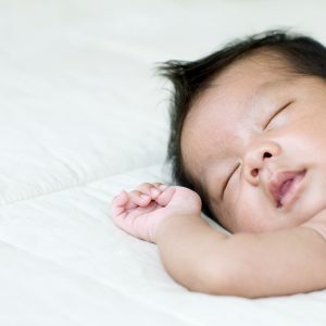 An image of a sleeping baby to promote the medicated patches for liver and gallbladder support from Frequency Apps.
