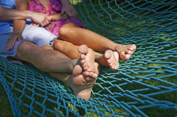 An image of a couple lying in a hammock to promote the homeopathic patch for relaxation from Frequency Apps.
